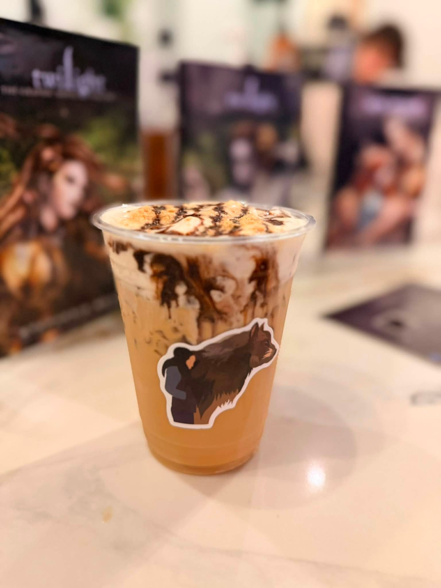 Iced latte topped with chocolate drizzle and graham crumbs