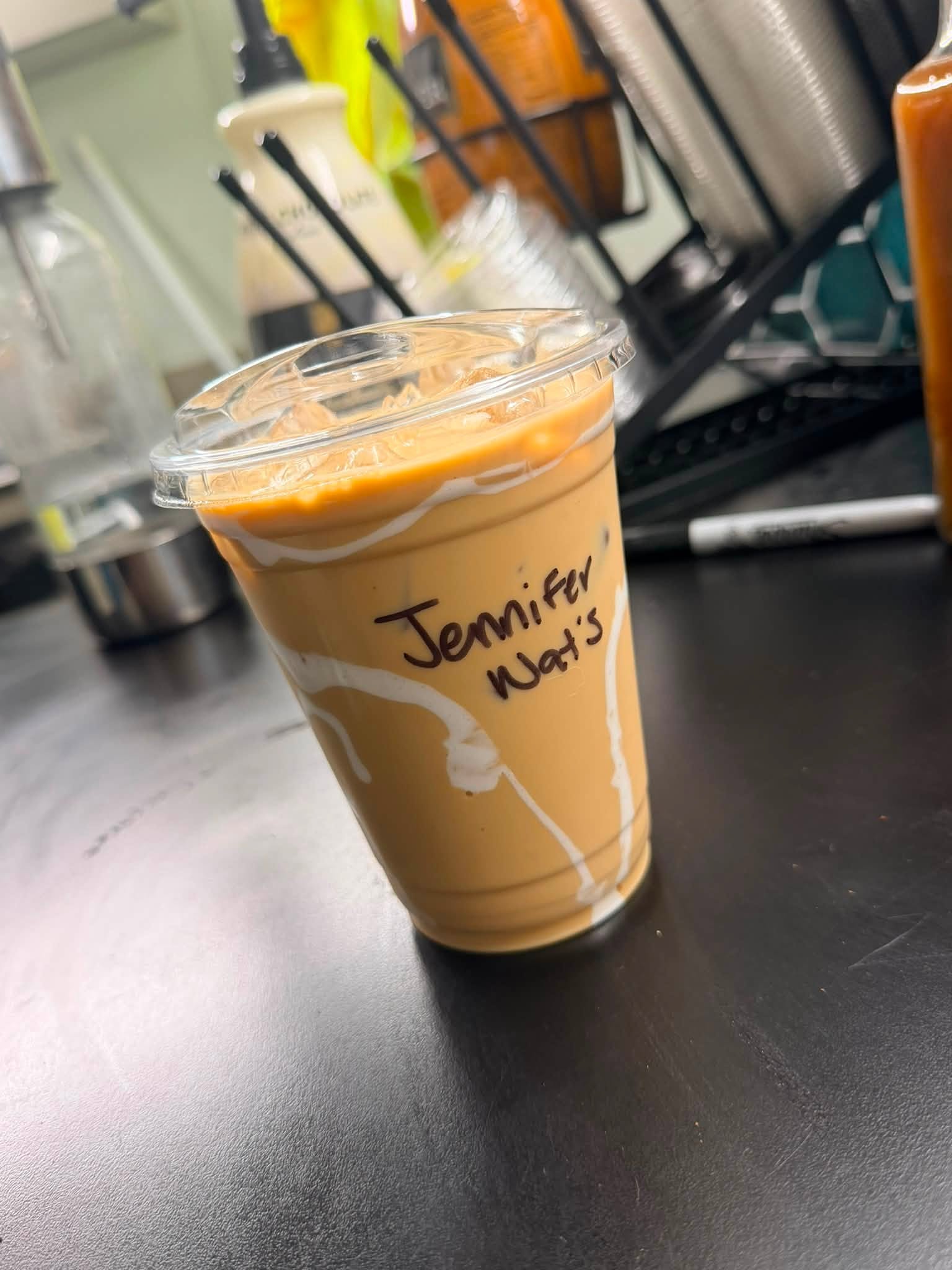 Iced latte with cream swirls